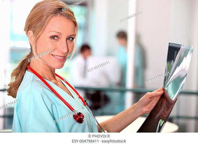 Female doctor looking at x-ray image