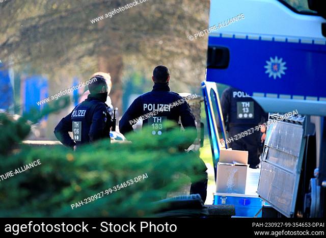 27 September 2023, Thuringia, Ilfeld: Police officers search a building complex as part of a nationwide operation. Federal Interior Minister Faeser (SPD) has...