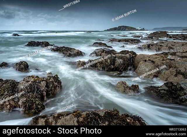 Stormy conditions on the rocky Bantham coast, looking across to Burgh Island, Devon, England, United Kingdom, Europe