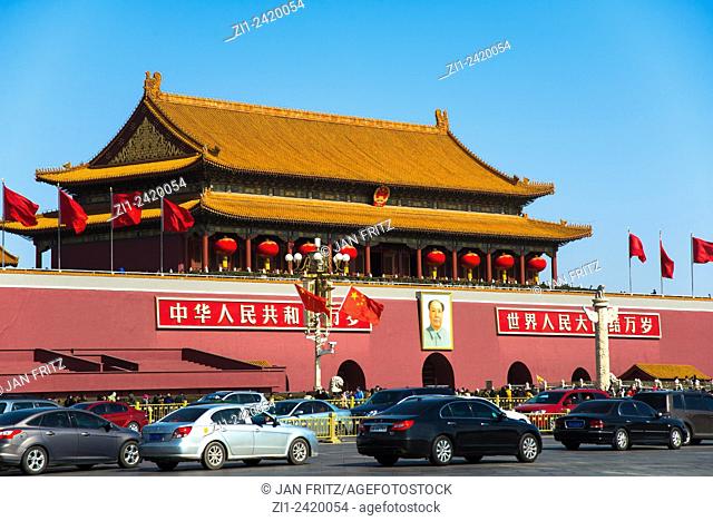 entrance of imperial forbidden city with mao image and traffic at beijing china
