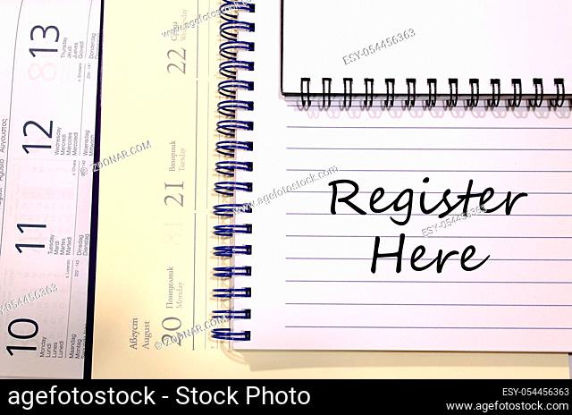 Register here text concept write on notebook