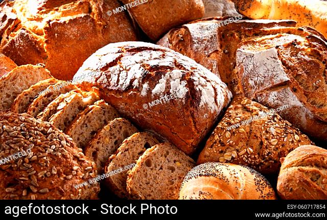 Assorted bakery products including loafs of bread and rolls