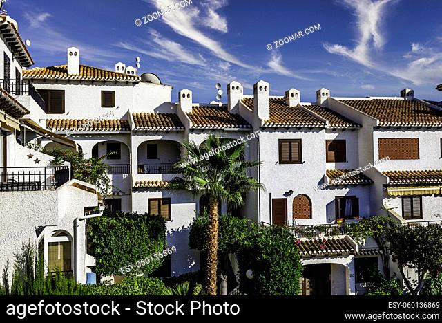 typical houses built in Spanish style and tropical plants
