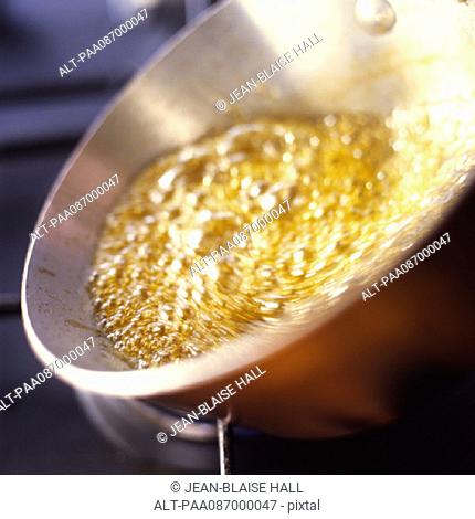 Close-up of caramel bubbling in pan
