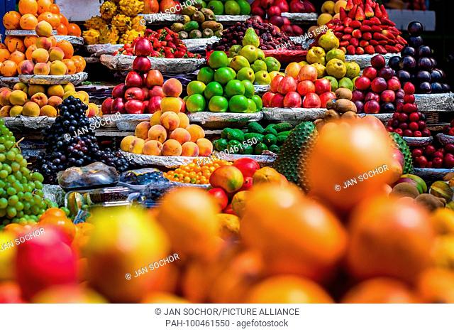 Piles of fruits (apples, peaches, passion fruits, wine grapes, plums etc.) are seen arranged at the fruit market of Paloquemao in Bogota, Colombia