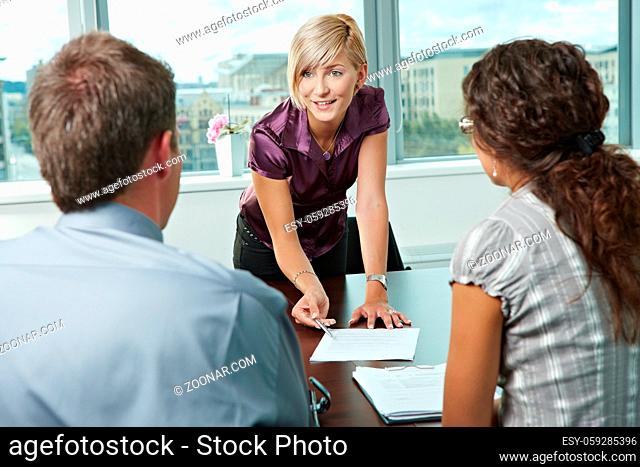 Team of casual looking business people having business meeting at office