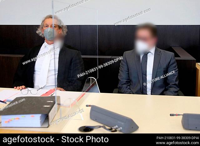 31 August 2021, North Rhine-Westphalia, Duesseldorf: The defendant (r) sits next to his defense lawyer, attorney Marc Francoise