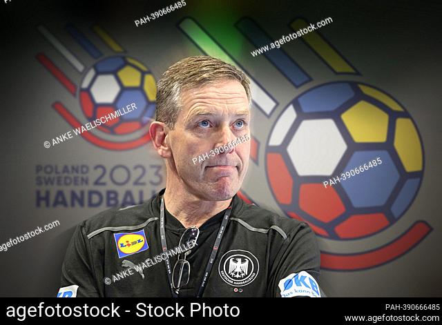PHOTO ASSEMBLY: Preview Handball World Cup 2023: coach/ national coach Alfred GISLASON (GER) in front of the logo of the World Cup in Poland and Sweden