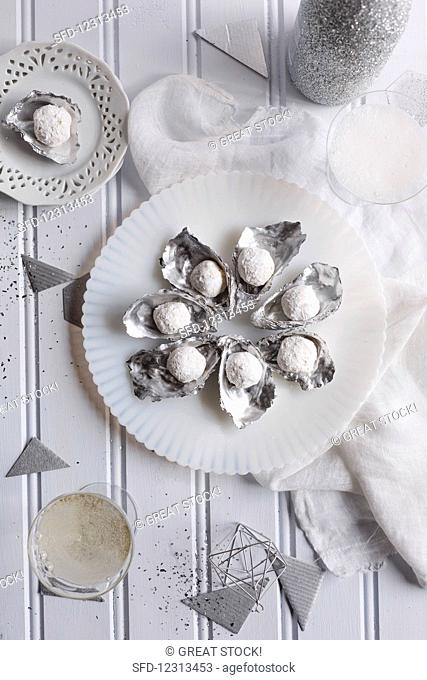 White champagne truffles in silver mussel shells
