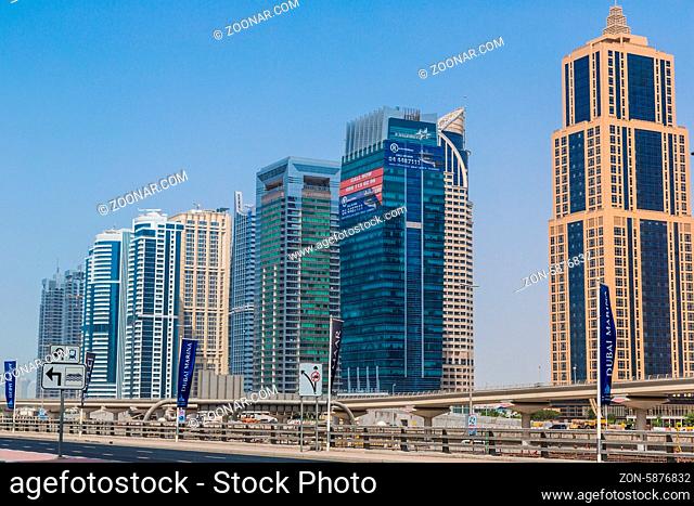 DUBAI, UAE - NOVEMBER 13: Modern skyscrapers in Dubai (emirate and city), UAE. Dubai now boasts more completed skyscrapers higher than 0, 8 - 0
