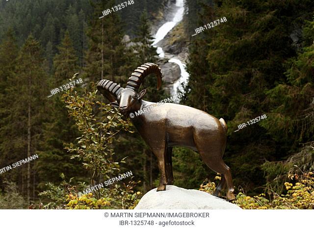 Bronze capricorn sculpture in front of the Krimmler Wasserfaelle waterfalls, Nationalpark Hohe Tauern national park, Krimml, Pinzgau, Salzburger Land county