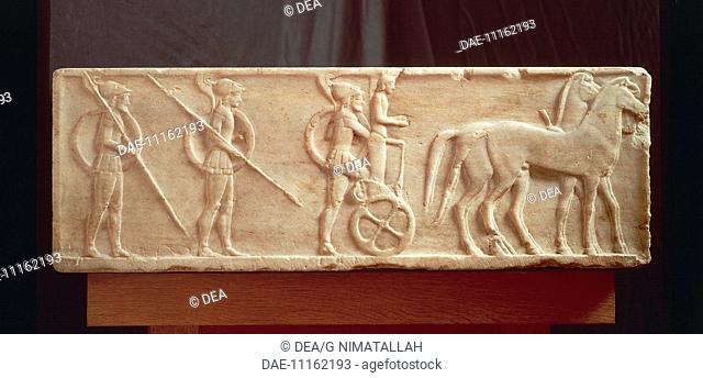 Greek civilization, 5th century b.C. Base of a Kouros with relief depicting a procession with hoplites.  Athens, Ethnikó Arheologikó Moussío (National...