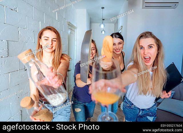 group of women having fun in the kitchen