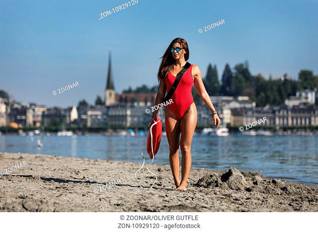 Young woman as a baywatch girl