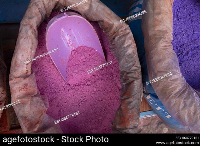 Close up sack with paint pigment in different colors for sale in a Moroccan street market. Chefchaouen