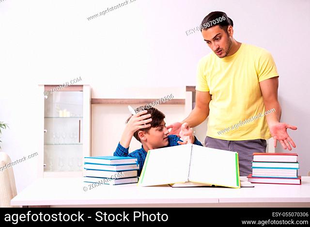 The father helping his son to prepare for school