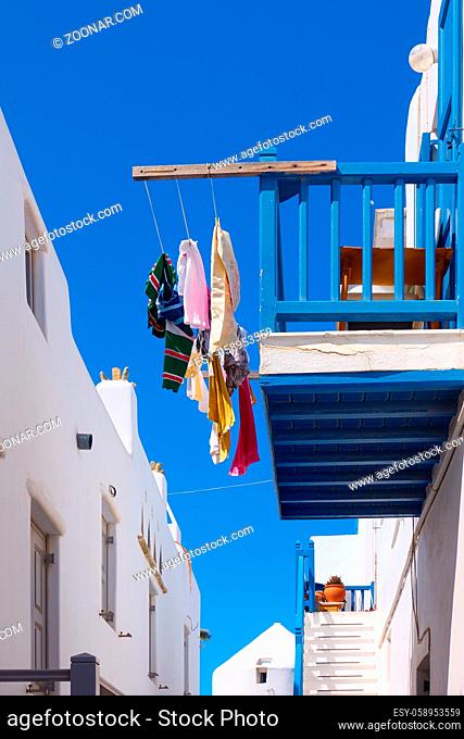 Balcony with airing clothes in Mykonos town, Greece