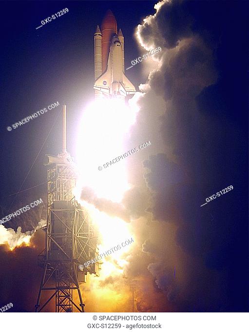 12/04/1998 -- The Space Shuttle Endeavour lights up the night sky as it embarks on the first U.S. mission, STS-88, dedicated to the assembly of the...