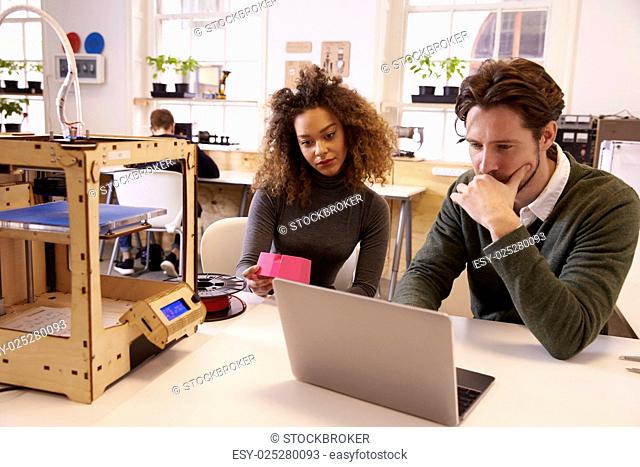 Designers Working With 3D Printer Refining Design