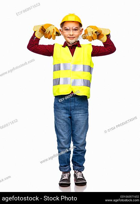boy in protective helmet showing power gesture