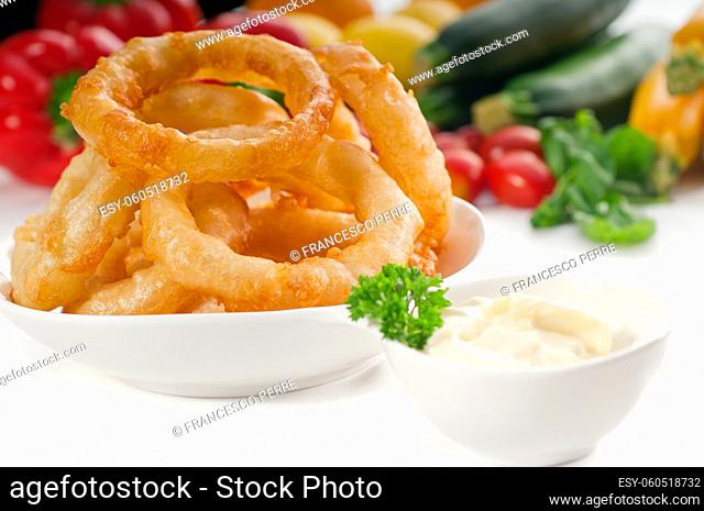 golden deep fried onion rings served with mayonnaise dip and fresh vegetables oln background , MORE DELICIOUS FOOD ON PORTFOLIO