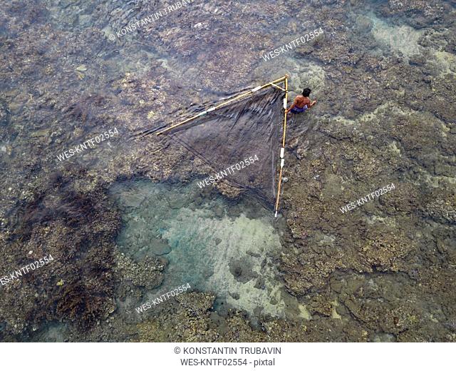 Indonesia, Bali, Aerial view of fisherman with net