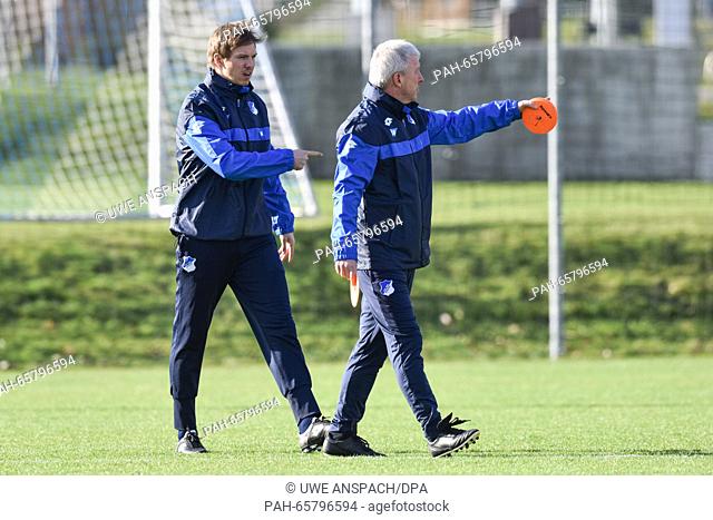 Julian Nagelsmann (l), new coach of the Bundesliga soccer club 1899 Hoffenheim, together with assistant coach Armin Reutershahn during practice in Zuzenhausen