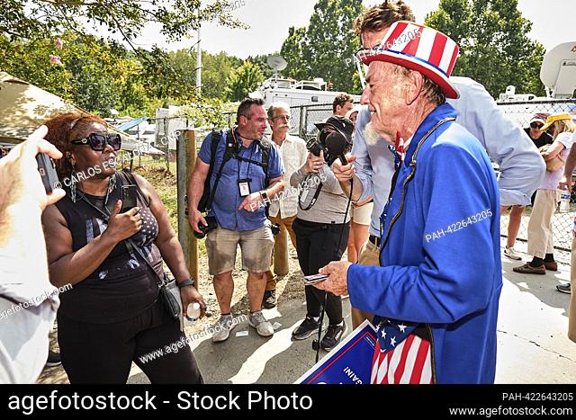 ATLANTA, GA. AUG 24 2023 - Opponents and supporters of former US President Donald J. Trump confront one another outside the Fulton County Jail in Atlanta