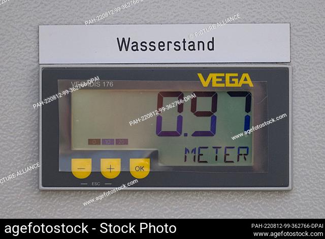 12 August 2022, Saxony, Dresden: The water level of the Elbe is displayed at a pumping station at the flood protection line in Dresden-Pieschen