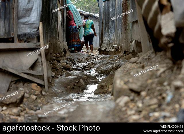 Haiti, Port-au-Prince, Icare Camp for earthquake refugees, Sewage between barracks