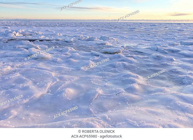 Frozen intertidal zone at sunrise, west coast Hudson Bay, south of Arviat, Nunavut, Canada