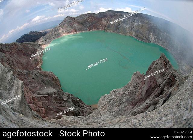 Turquoise-green coloured acidic volcanic crater lake with rising steam, Mount Ijen, East Java, Indonesia, Asia