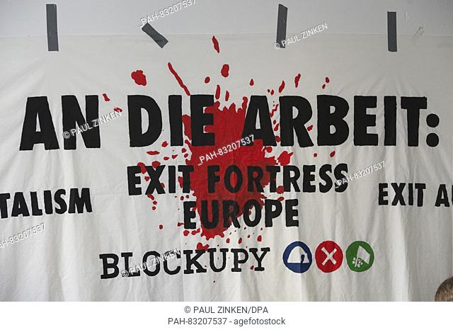 """""An die Arbeit: Exit Fortress Europe"" is written on a banner of the Blockupy alliance in Berlin, Germany, 31 August 2016