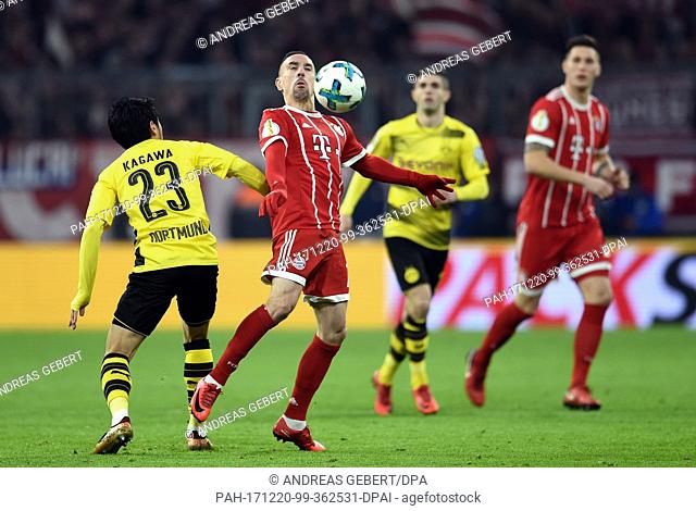 Dortmund's Shinji Kagawa and Munich's Franck Ribery (2-L) vie for the ball during the German DFB (German Football Association) Cup soccer match between Bayern...