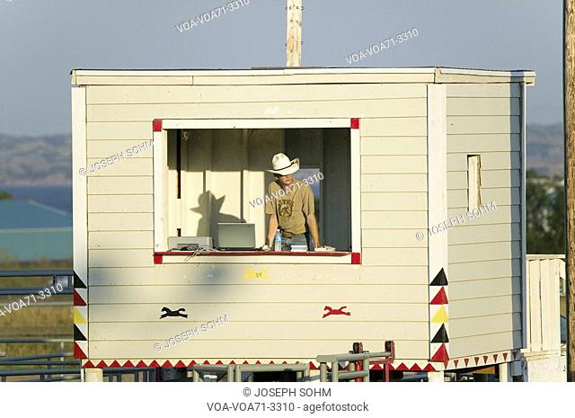 Announcer with cowboy hat at PRCA Rodeo at Lower Brule, Lyman County, Lower Brule Sioux Tribal Reservation, South Dakota