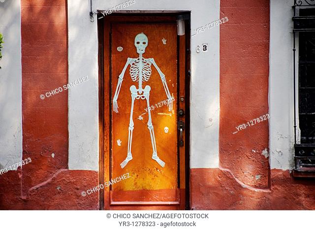 A skeleton decorates a home's door in Coyoacan ahead of Day of the Dead celebrations, Mexico City