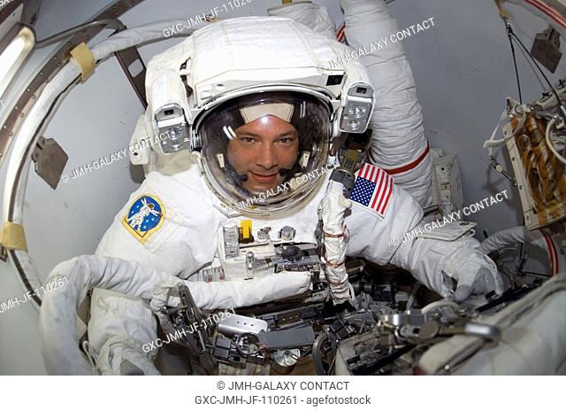 Attired in his Extravehicular Mobility Unit (EMU) spacesuit, astronaut Doug Wheelock, STS-120 mission specialist, is pictured as he is about the leave the...