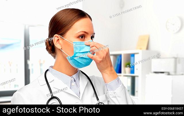 happy female doctor wearing medical mask