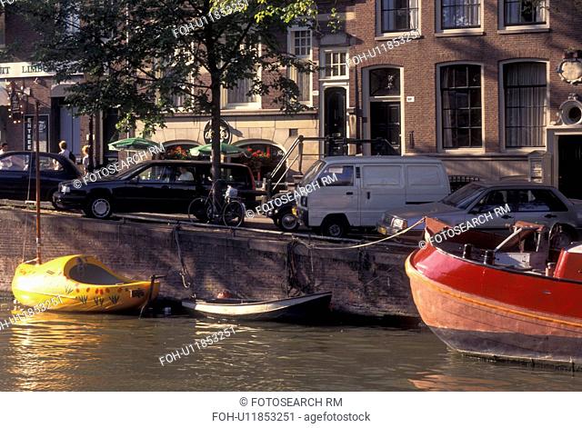 Amsterdam, Holland, Netherlands, Noord-Holland, Europe, Boat shaped like a wooden shoe docked along a canal in Amsterdam