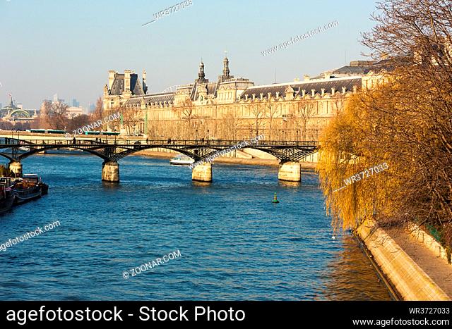 Bridges on the Seine river and passenger ships as a public transport vehicle in Paris