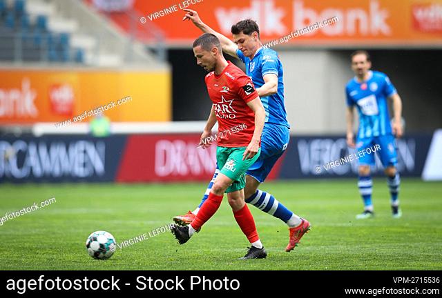 Oostende's Maxime D'Arpino and Gent's Roman Yaremchuk fight for the ball during a soccer match between KAA Gent and KV Oostende, Thursday 13 May 2021 in Gent