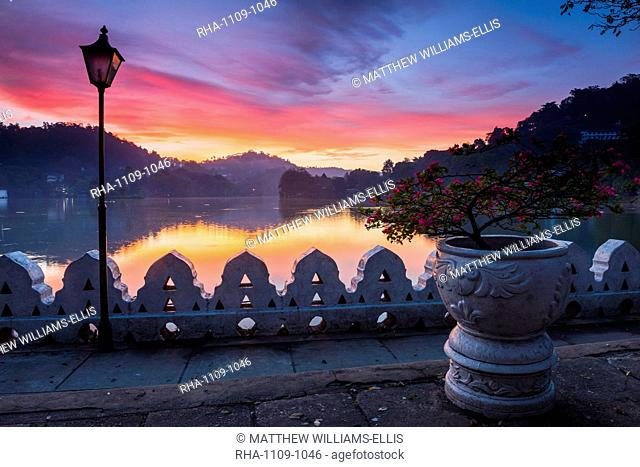 Dramatic sunrise at Kandy Lake and the Clouds Wall (Walakulu Wall), Kandy, Central Province, Sri Lanka, Asia