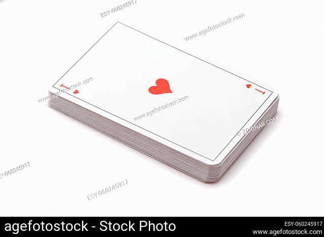 Deck of playing cards with ace of hearts on top isolated on white