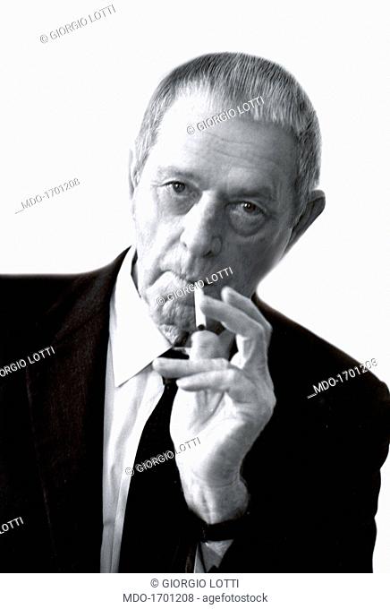 Erskine Caldwell smoking a cigarette. American writer and journalist Erskine Caldwell smoking a cigarette. 1975