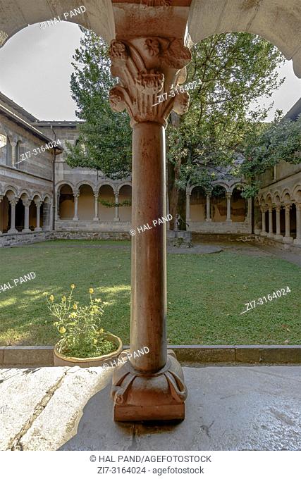 detail of mullion and capitol at Romanesque cloister of Abbey on shore of Lario lake, shot in bright fall light at Piona, Lecco, Italy