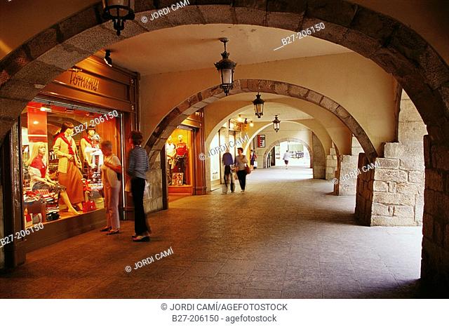 Shops under the porticos of Rambla de la Llibertat street. Girona. Spain
