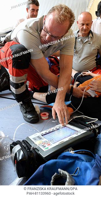 Rescue assistant Harald Hartmann of the rescue helicopter Christoph 41 team of the DRF Air Rescue, taking care of a patient near Leonberg, Germany, 3 June 2016