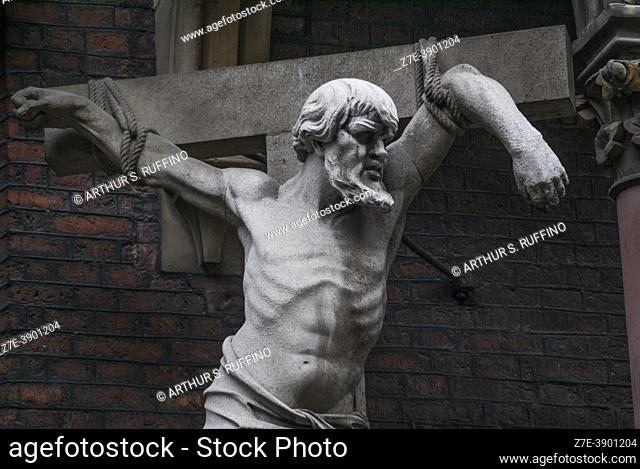 Sculpture, part of a sculptural group depicting the Calvary crucifixions on the exterior of St. Lambertus Basilica, Stiftplatz, Dusseldorf, Germany