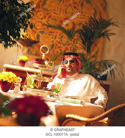 Arab businessman having lunch break