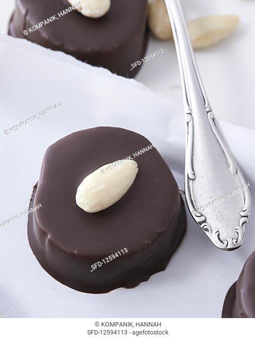 A marzipan nougat biscuit with chocolate glaze, close-up